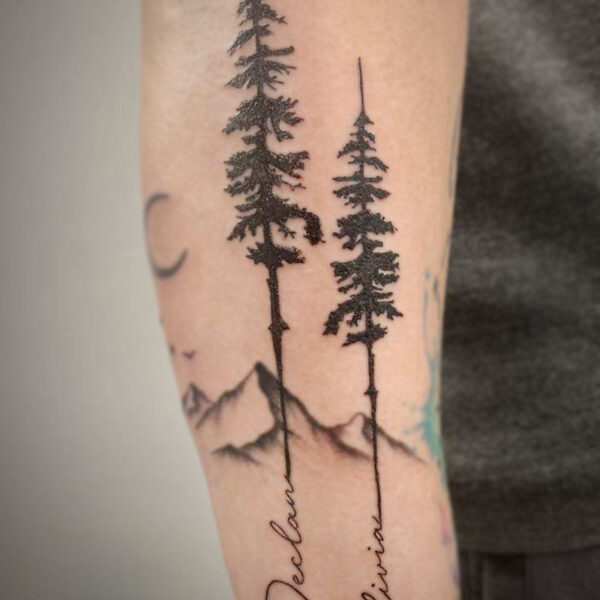 atticus tattoo, black tattoo of two pine trees with names as the trunk