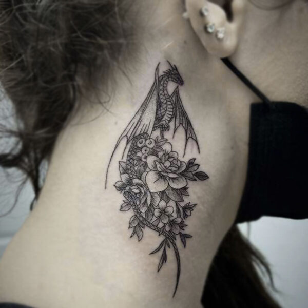 atticus tattoo, black and white tattoo of a dragon with flowers