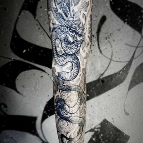 atticus tattoo, black and grey tattoo of an Eastern dragon