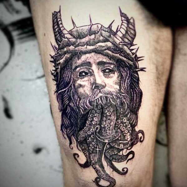 atticus tattoo, black and grey tattoo of Jesus's head with horns and tentacles coming out of his mouth