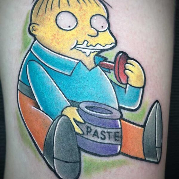 atticus tattoo, coloured neotraditional tattoo of Ralph Wiggum from Simpsons eating glue