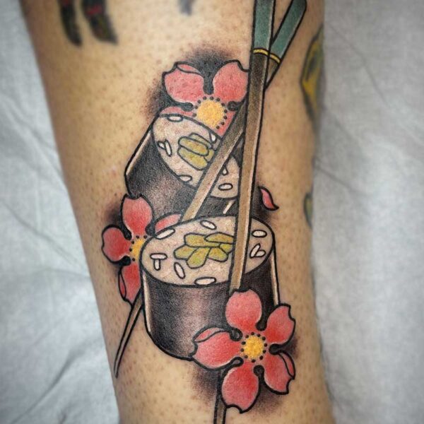 atticus tattoo, coloured neotraditional tattoo of sushi rolls and chopsticks