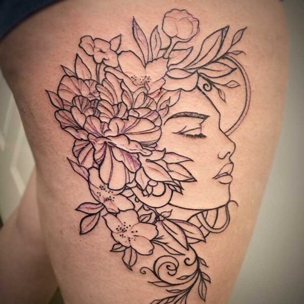 atticus tattoo, line tattoo of a woman's face with flowers in her hair