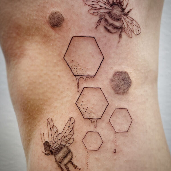atticus tattoo, fine line tattoo of bees with hexagons and dripping honey