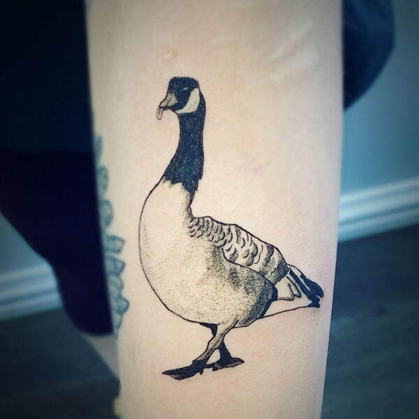 atticus tattoo, black and grey tattoo of a Canadian Goose with its tongue sticking out