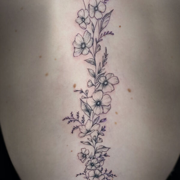 atticus tattoo, fine line tattoo of various flowers