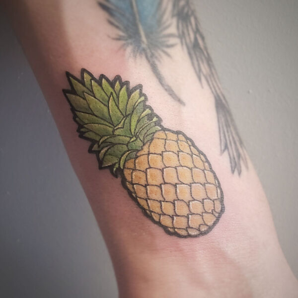 atticus tattoo, coloured tattoo of a pineapple