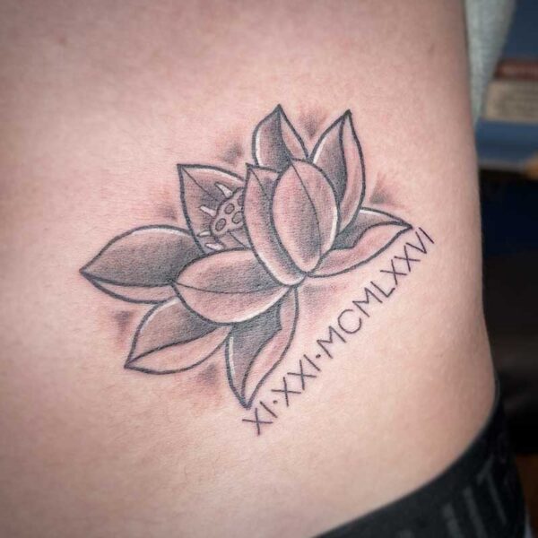atticus tattoo, black and grey neotraditional tattoo of a lotus
