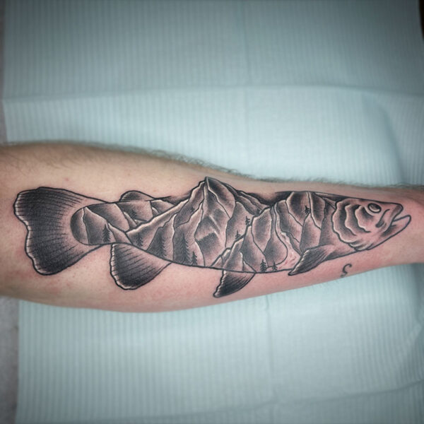 atticus tattoo, black and grey neotraditional tattoo of a fish with a mountain scene as the body