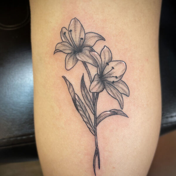 atticus tattoo, black and grey tattoo of two lilies
