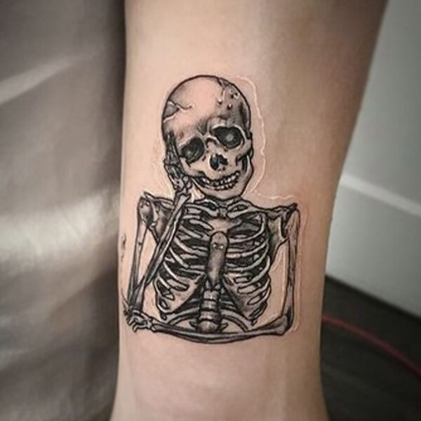 atticus tattoo, black and grey tattoo of a skeleton