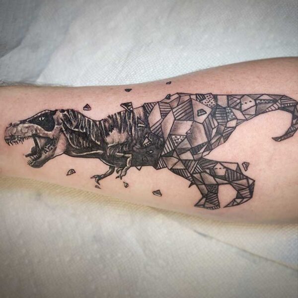 atticus tattoo, black and grey tattoo of a t-rex with half of the body made out of geometric shapes