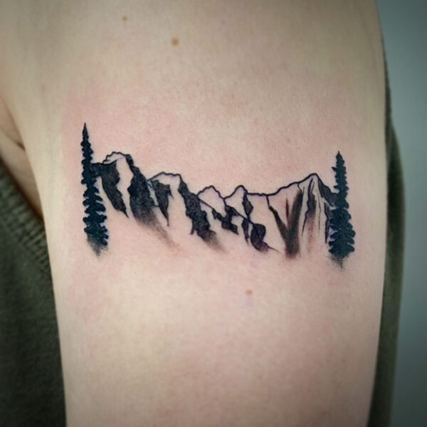 atticus tattoo, black and white tattoo of the mountain range at Morraine Lake
