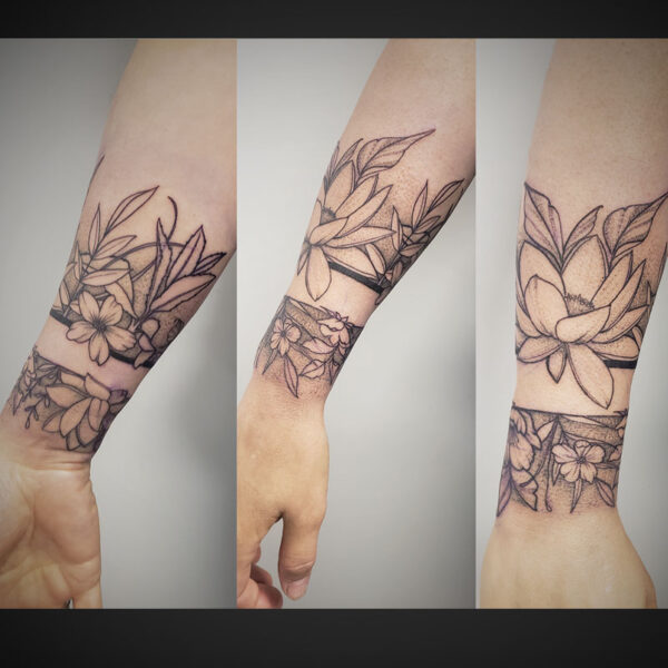 atticus tattoo, fine line arm band tattoo of flowers