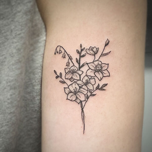 atticus tattoo, fine line tattoo of a small bouquet of flowers