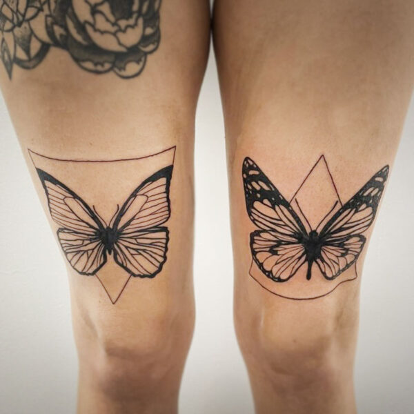 atticus tattoo, black and white tattoo of two butterflies over two triangles