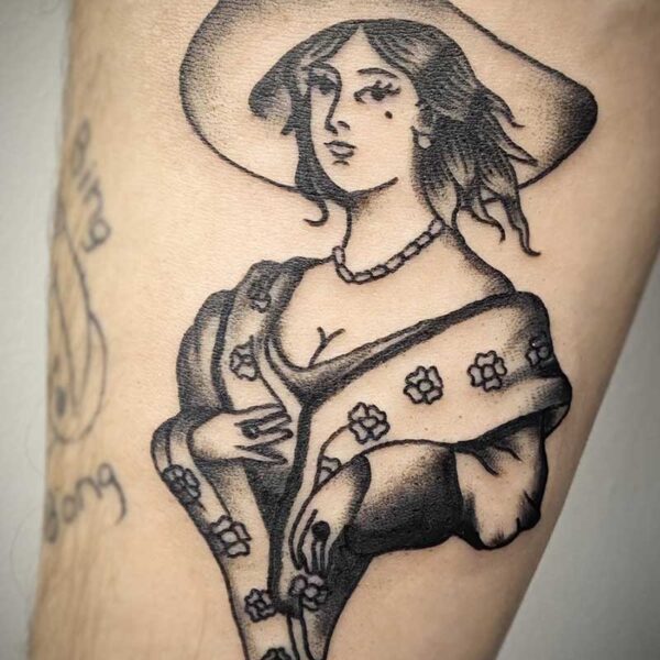 atticus tattoo, black and grey american traditional style tattoo of a woman in a floral dress and a sunhat