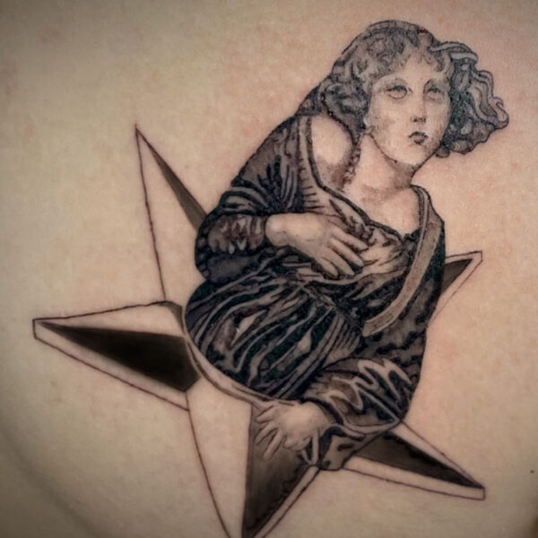 atticus tattoo, black and grey tattoo of a renaissance style woman coming out of a star