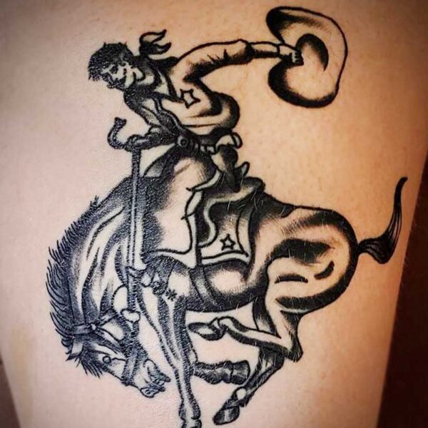 atticus tattoo, black and grey american traditional style tattoo of a cowboy on a bucking horse