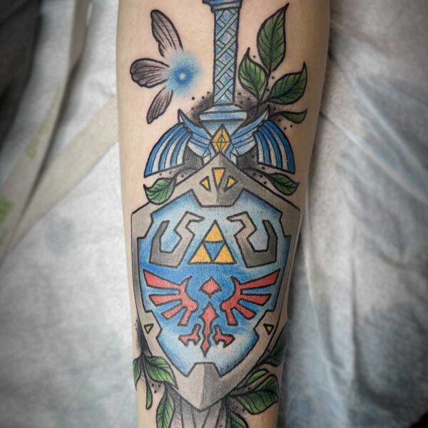 atticus tattoo, coloured neotraditional tattoo of Link's sword and shield