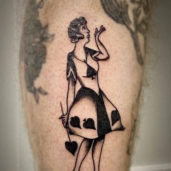 atticus tattoo, black and grey american traditional style tattoo of a woman wearing a dress with spades and holding a spade wand