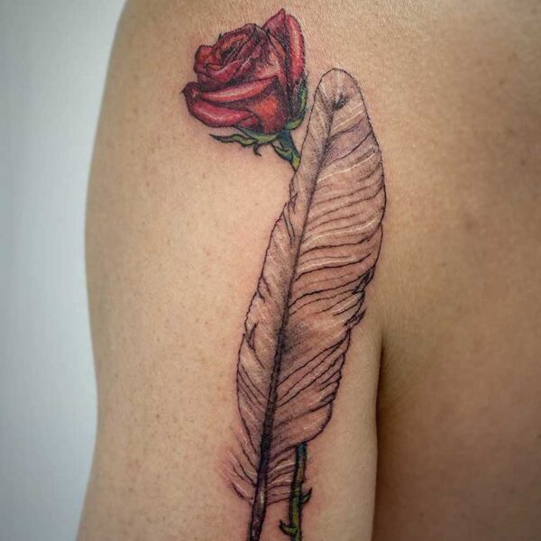 atticus tattoo, coloured tattoo of a rose with a feather