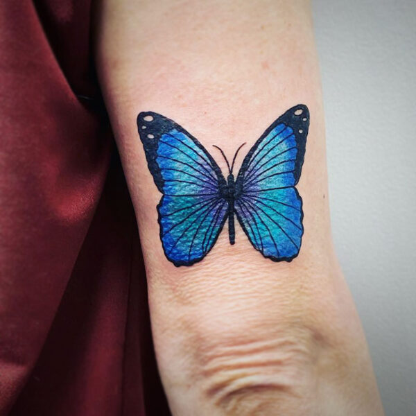 atticus tattoo, coloured tattoo of a blow butterfly