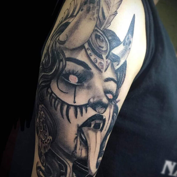 atticus tattoo, black and grey realism tattoo of a woman demon