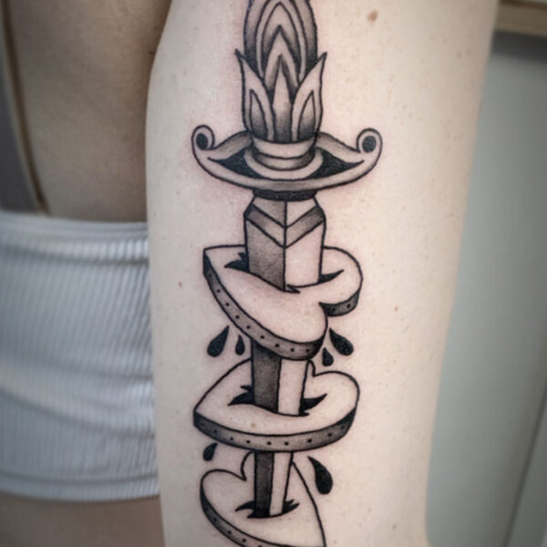 atticus tattoo, traditional tattoo of a dagger stabbing three hearts