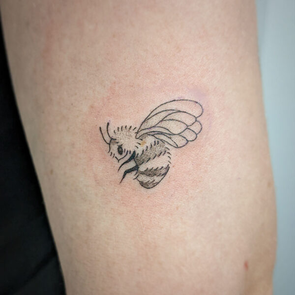 atticus tattoo, fine line tattoo of a bumble bee