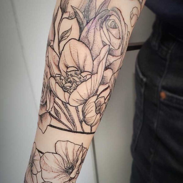 atticus tattoo, fine line tattoo of a floral arm band
