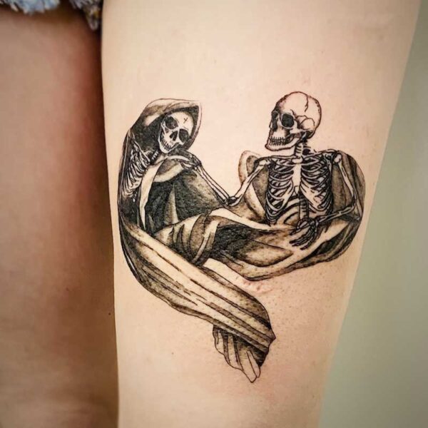atticus tattoo, black and grey tattoo of a pair of skeletons sharing a blanket