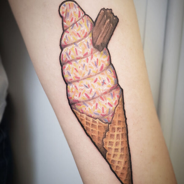 atticus tattoo, coloured tattoo of an ice cream cone with sprinkles
