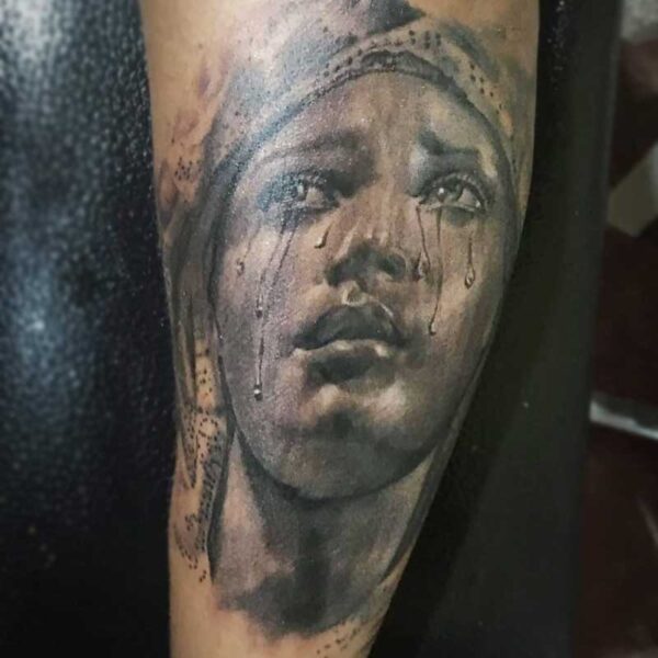 atticus tattoo, black and grey realism tattoo of Mary crying