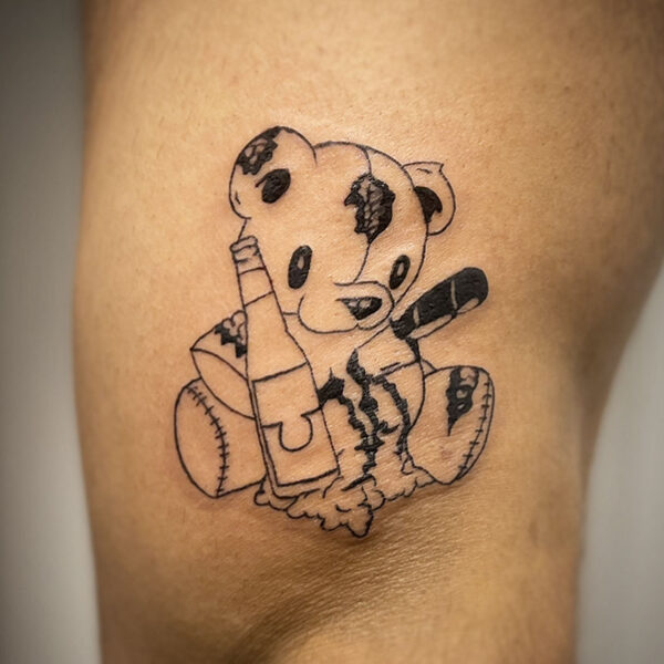 atticus tattoo, tattoo of a ripped teddy bear with a beer bottle and a knife
