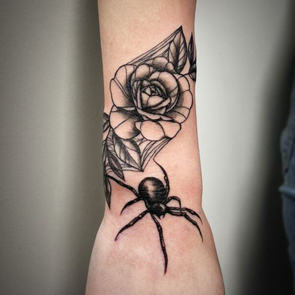 atticus tattoo, fine line tattoo of a spider with a rose caught in a web