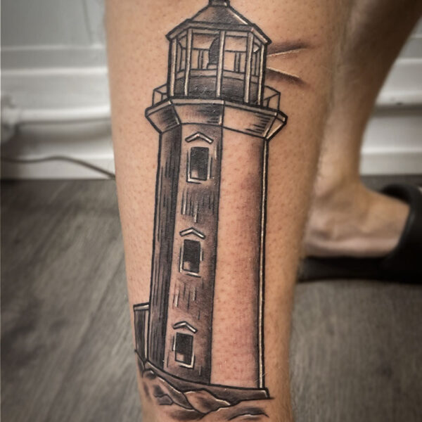 atticus tattoo, black and grey tattoo of a lighthouse