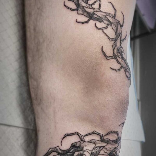 atticus tattoo, fine line tattoo of a centipede monster