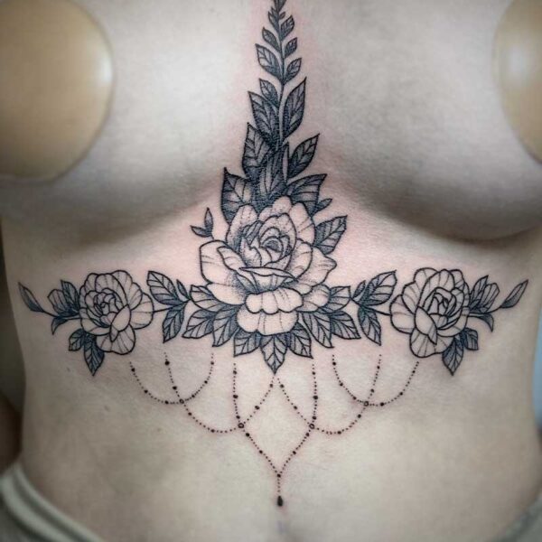 atticus tattoo, black and grey tattoo of roses with leaves and jewels