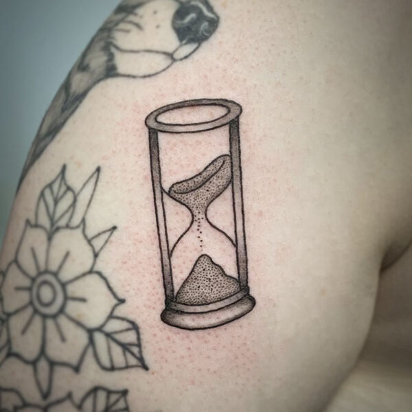 atticus tattoo, black and grey tattoo of an hourglass