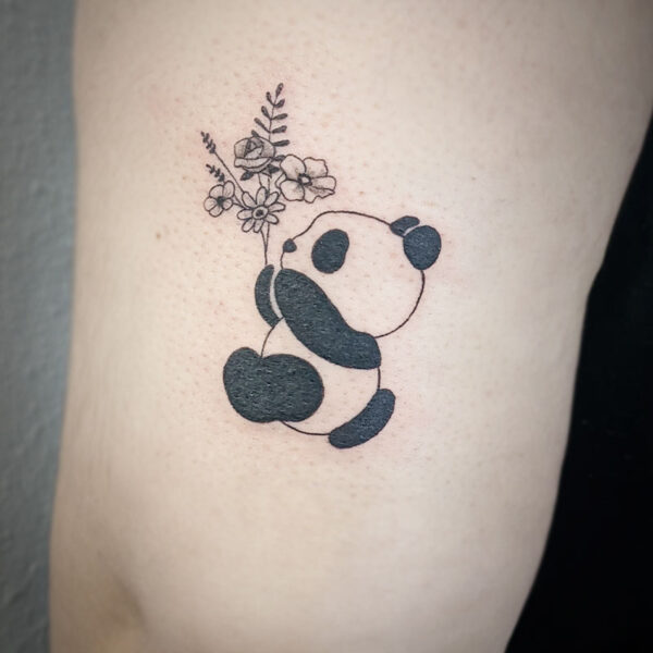 atticus tattoo, fine line tattoo of a panda holding a bouquet of flowers