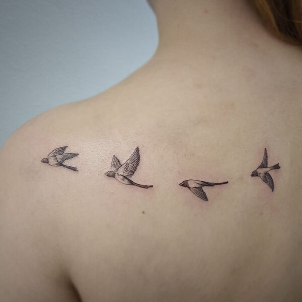 atticus tattoo, black and grey tattoo of four small birds