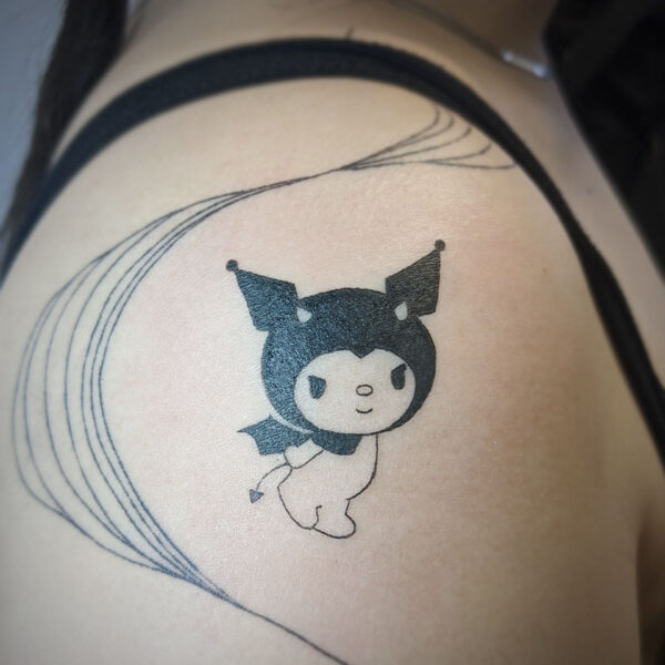 atticus tattoo, black and white tattoo of a hello kitty wearing a devil hood