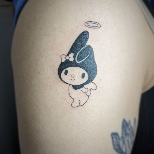 atticus tattoo, black and white tattoo of a hello kitty with rabbit ears
