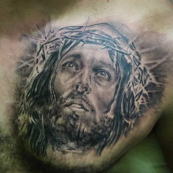 atticus tattoo, black and grey realism tattoo of Jesus