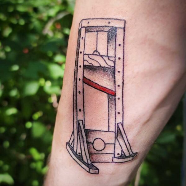 atticus tattoo, black and grey American traditional tattoo of a guillotine