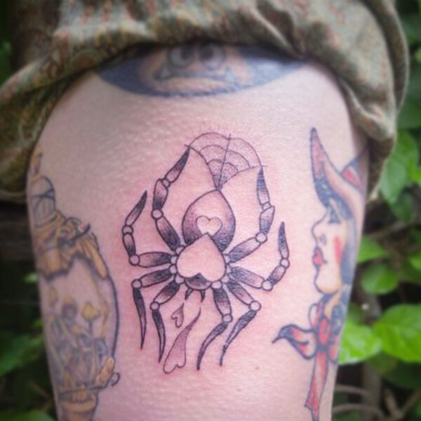 atticus tattoo, black and grey American traditional tattoo of a spider with a heart on its back