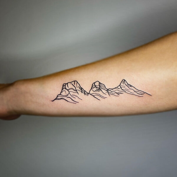atticus tattoo, black line tattoo of the three sisters from Canmore