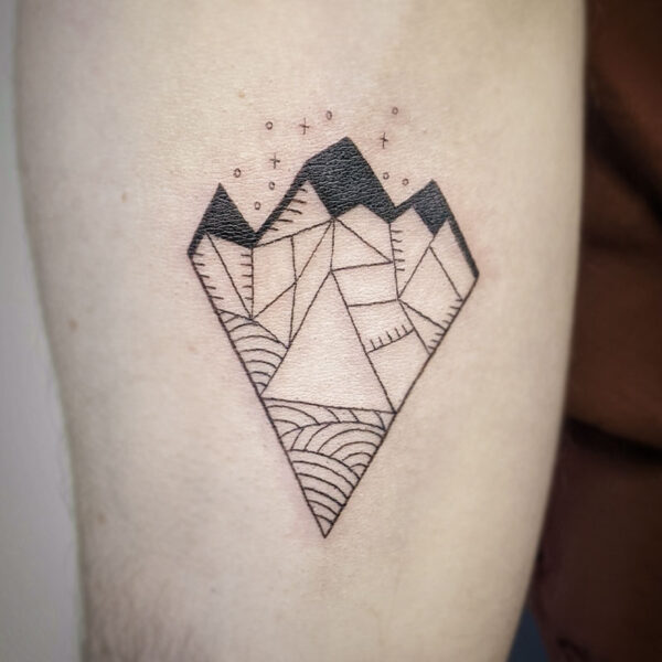 atticus tattoo, fine line, geometric tattoo of a mountain range in a diamond shape