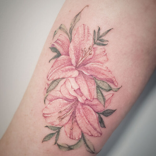 atticus tattoo, coloured tattoo of lilies